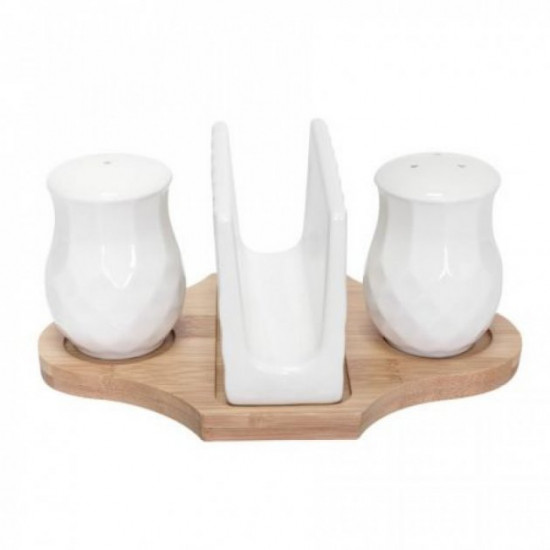 A set of salt and pepper specialties on a bamboo stand with a napkin holder Krauff 21-275-021